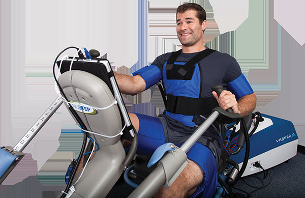 A session on the Vasper system. Compression cuffs, cooling vest, recumbent trainer.